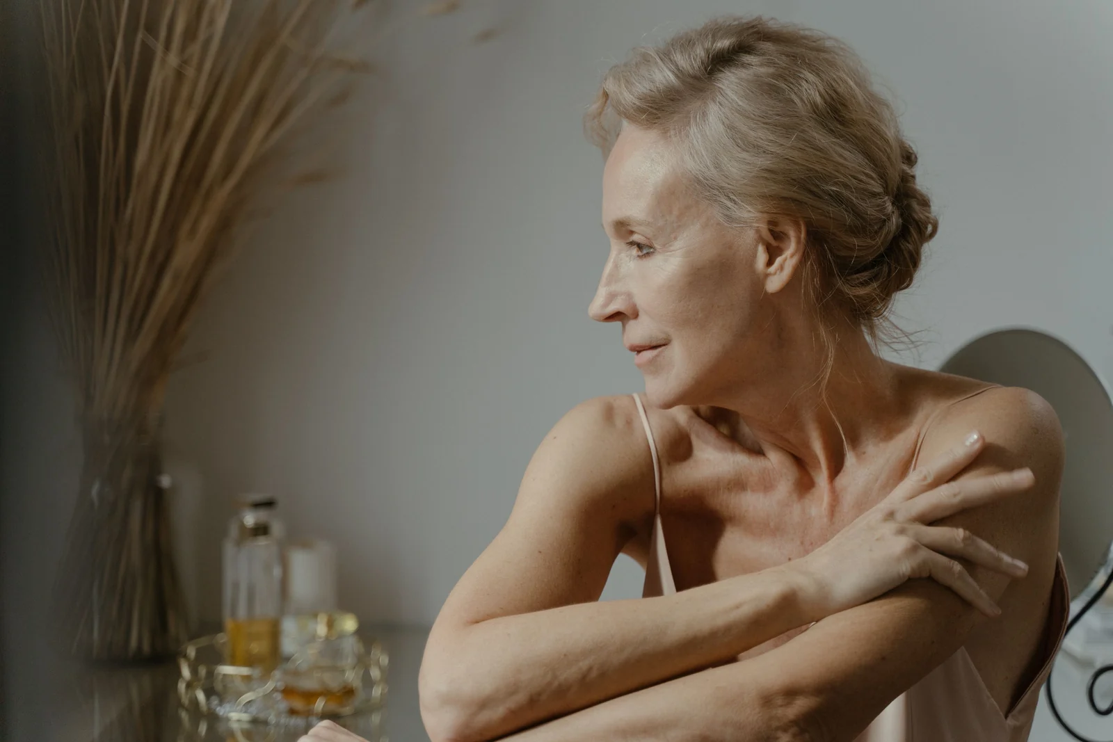A woman having a quiet moment at her dressing table