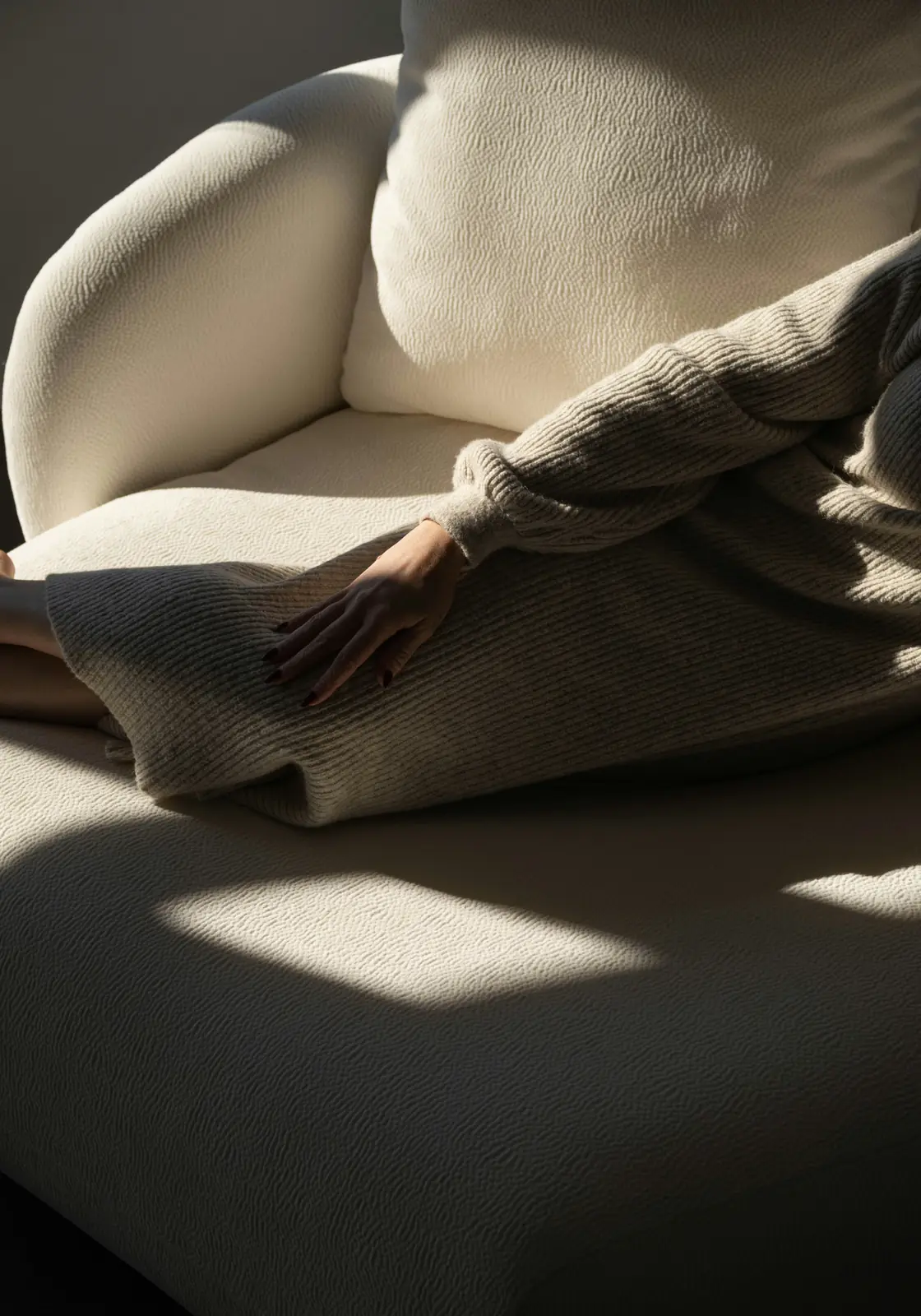 Afternoon light falling across a sofa
